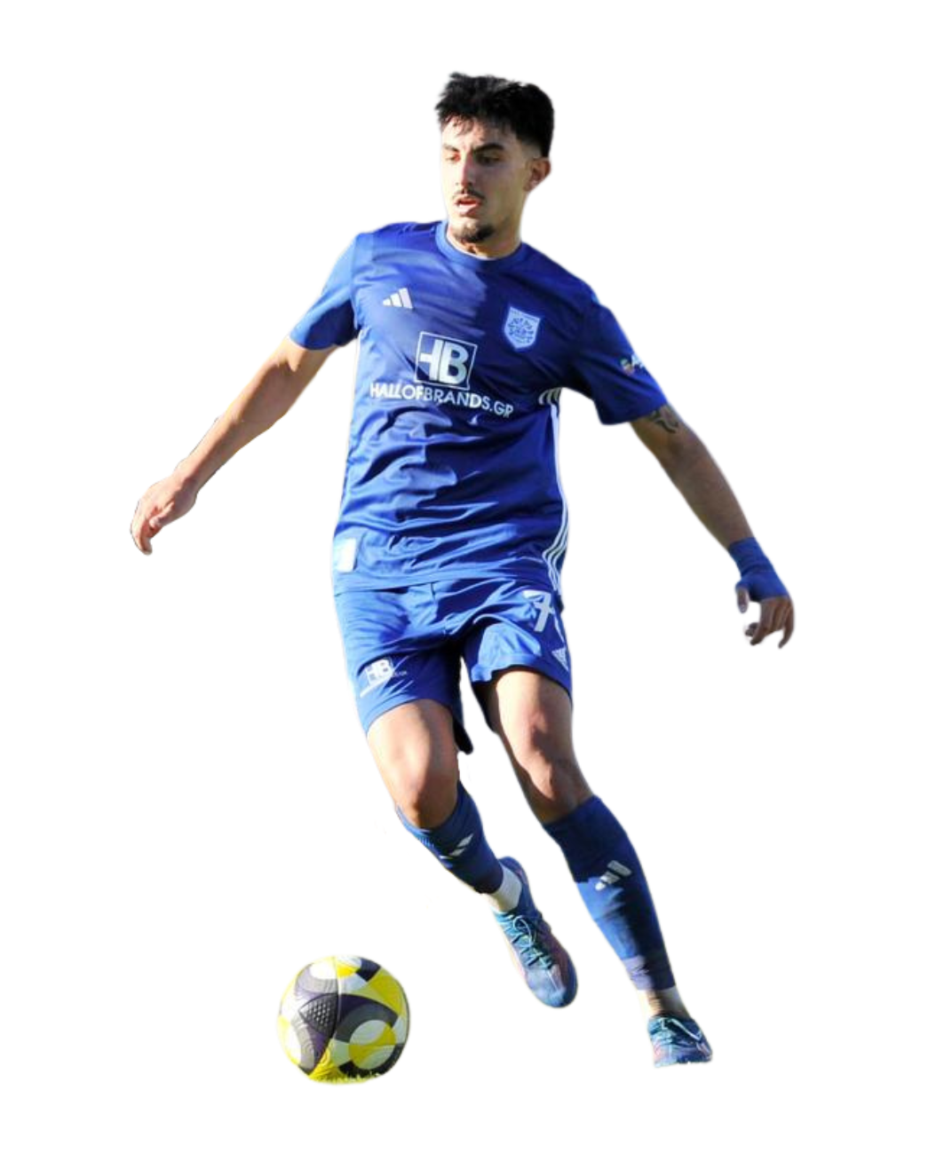 Soccer player in blue uniform controlling a yellow and black ball.