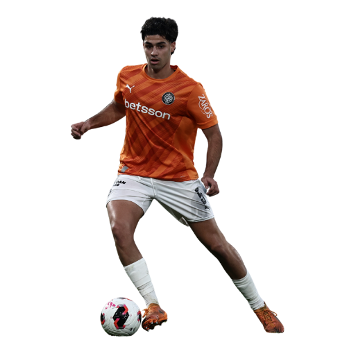 Soccer player in black and white uniform kicking a ball.