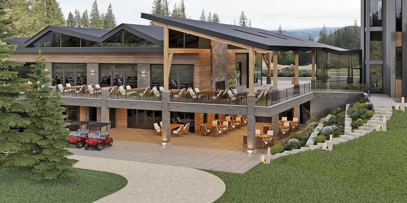 Modern lodge with two levels of outdoor seating, wooden beams, glass walls, surrounded by trees and greenery.