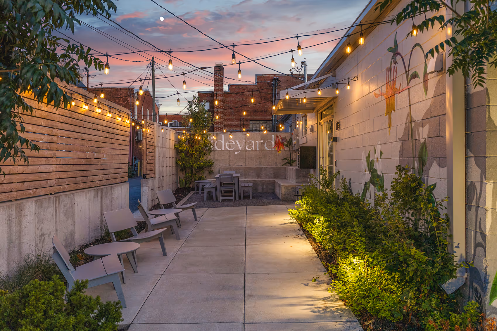 A photo of the outdoor patio at Sideyard Gallatin in the evening at sunset.