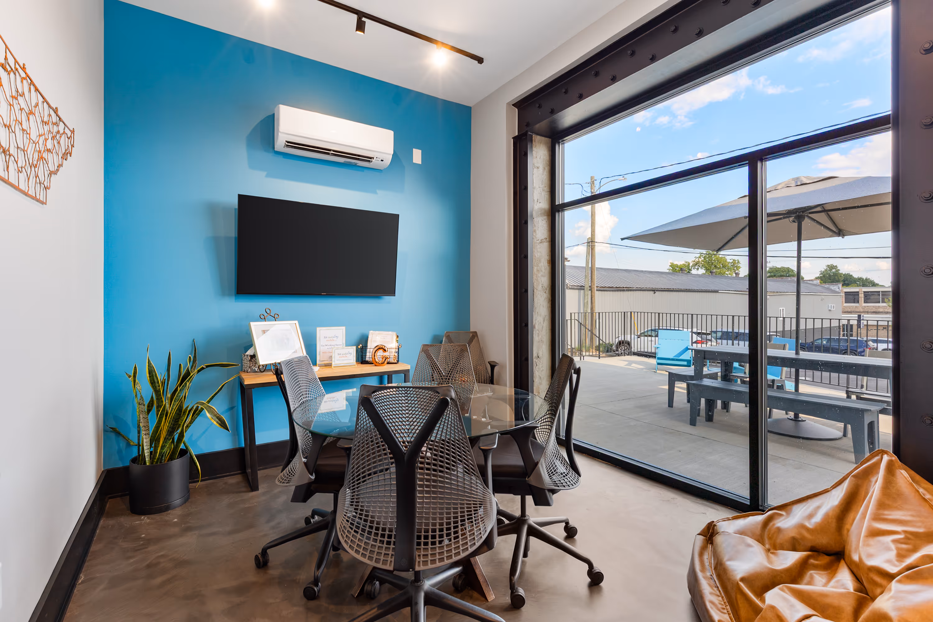 Private meeting room at Station Gallatin with a view of the back patio.