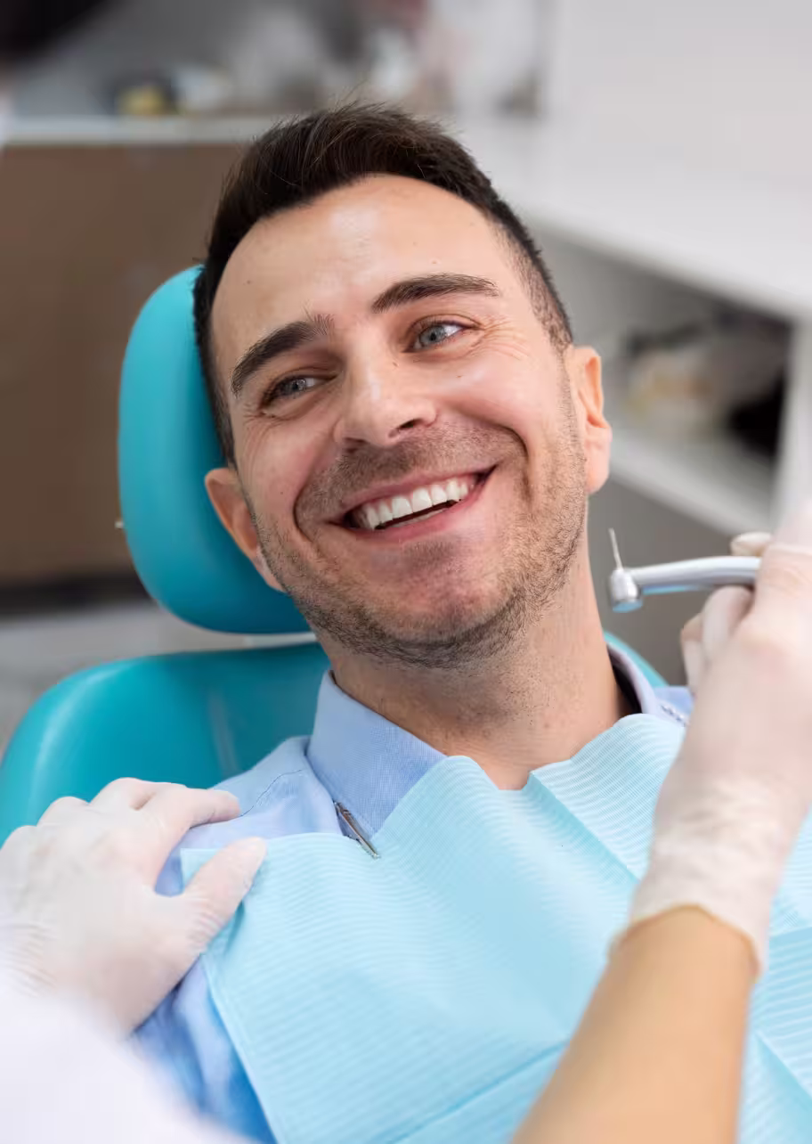 Woman with a radiant smile after porcelain veneer treatment
