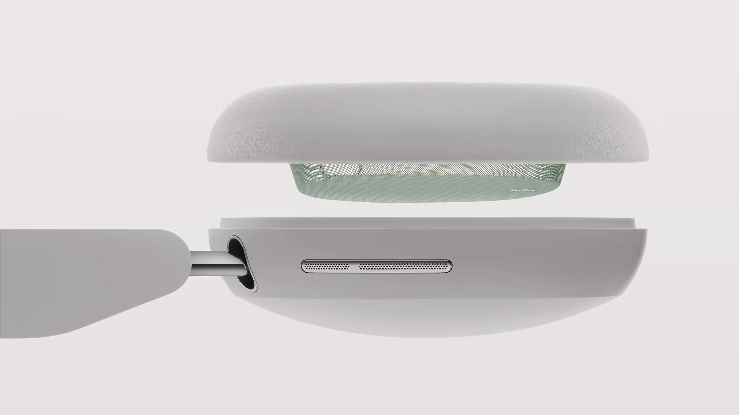 Exploded side view of white wireless headphones showing speaker mesh and internal components.