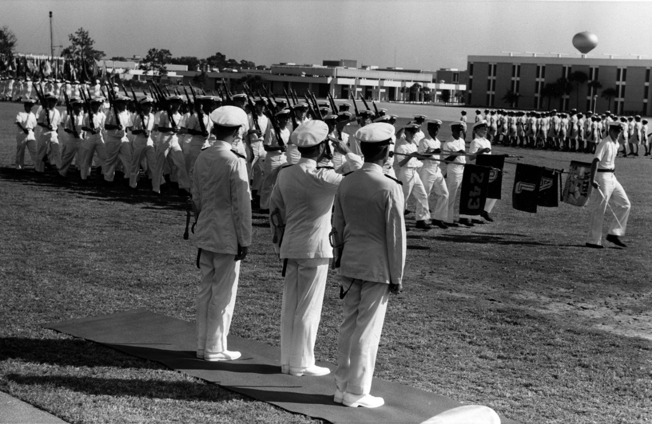 Navy recruits pass in review at Naval Training Center Orlando, Florida. (1975)