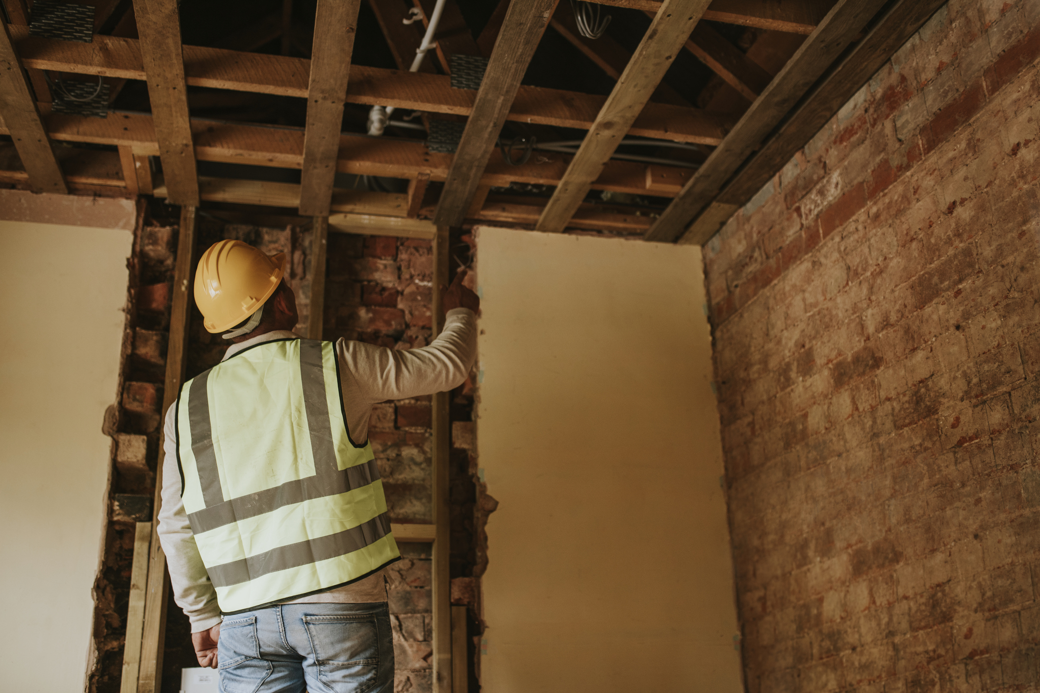Contractor inspecting home construction