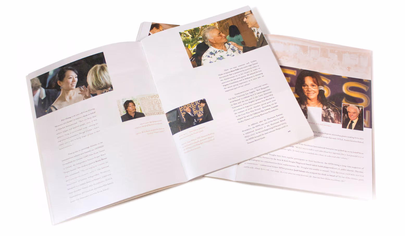 Open photo book spread showing images and text from the Golden Globes awards ceremony event.