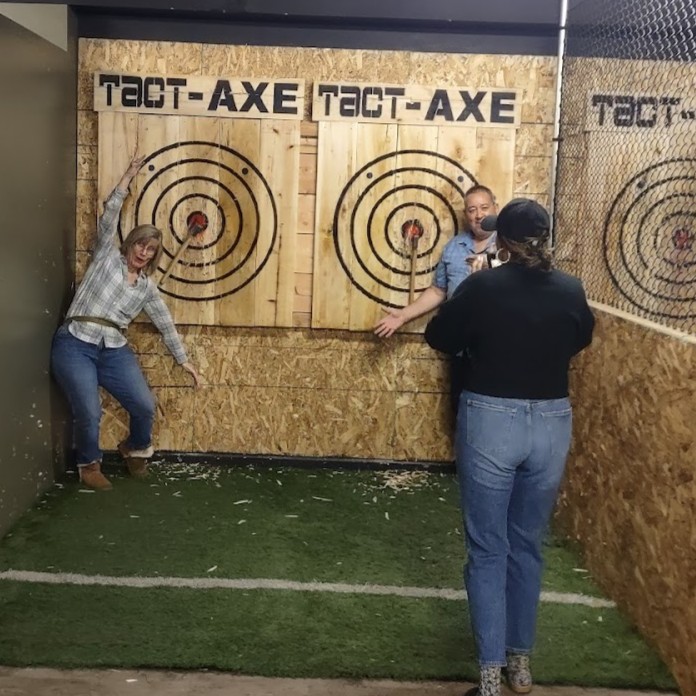 image of park with people enjoying rides