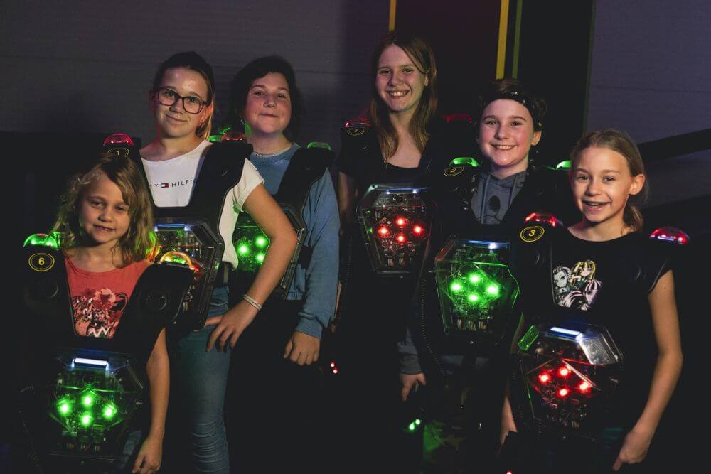 image of park with people enjoying rides