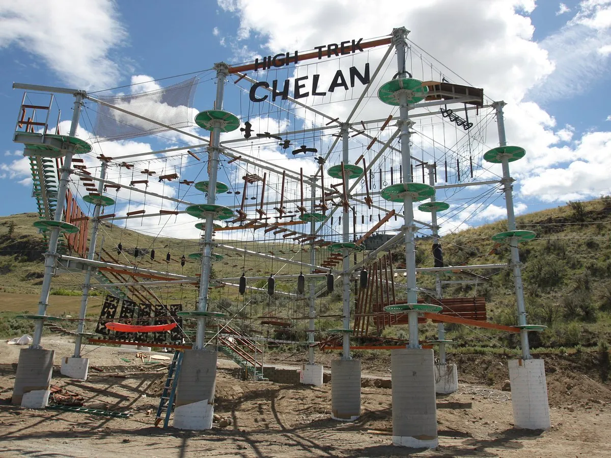 image of park with people enjoying rides