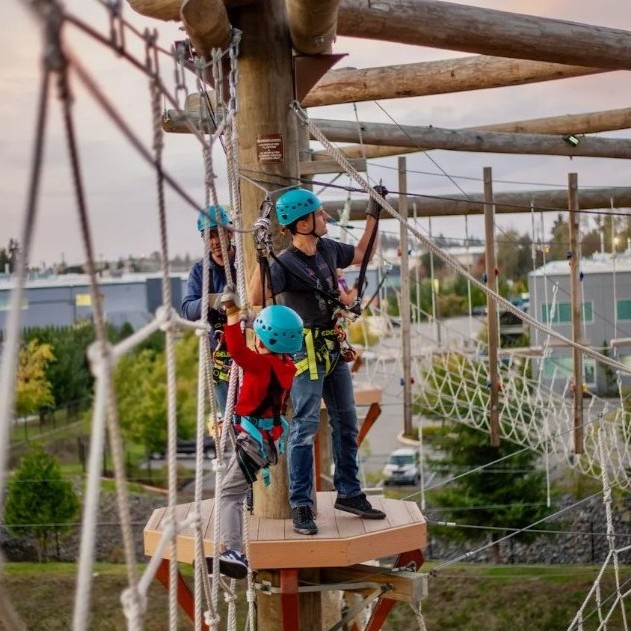 image of park with people enjoying rides
