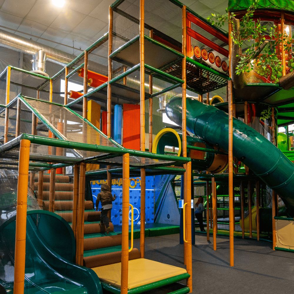 image of park with people enjoying rides