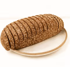 Sliced loaf of multi-grain bread on a beige plate.