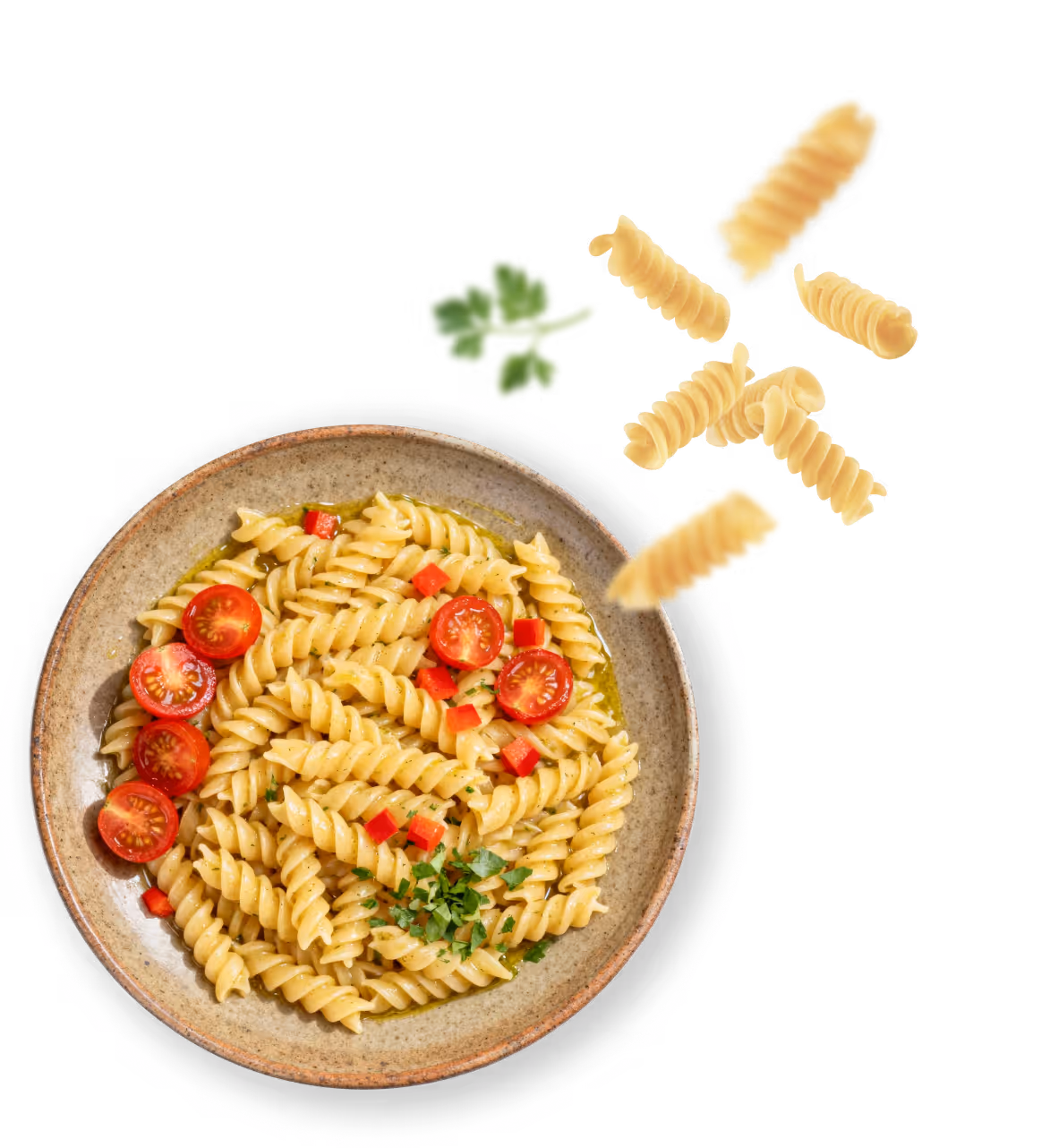 Plate of fusilli pasta garnished with cherry tomato halves, chopped red bell pepper, and parsley with some uncooked pasta spirals and parsley leaf floating above.