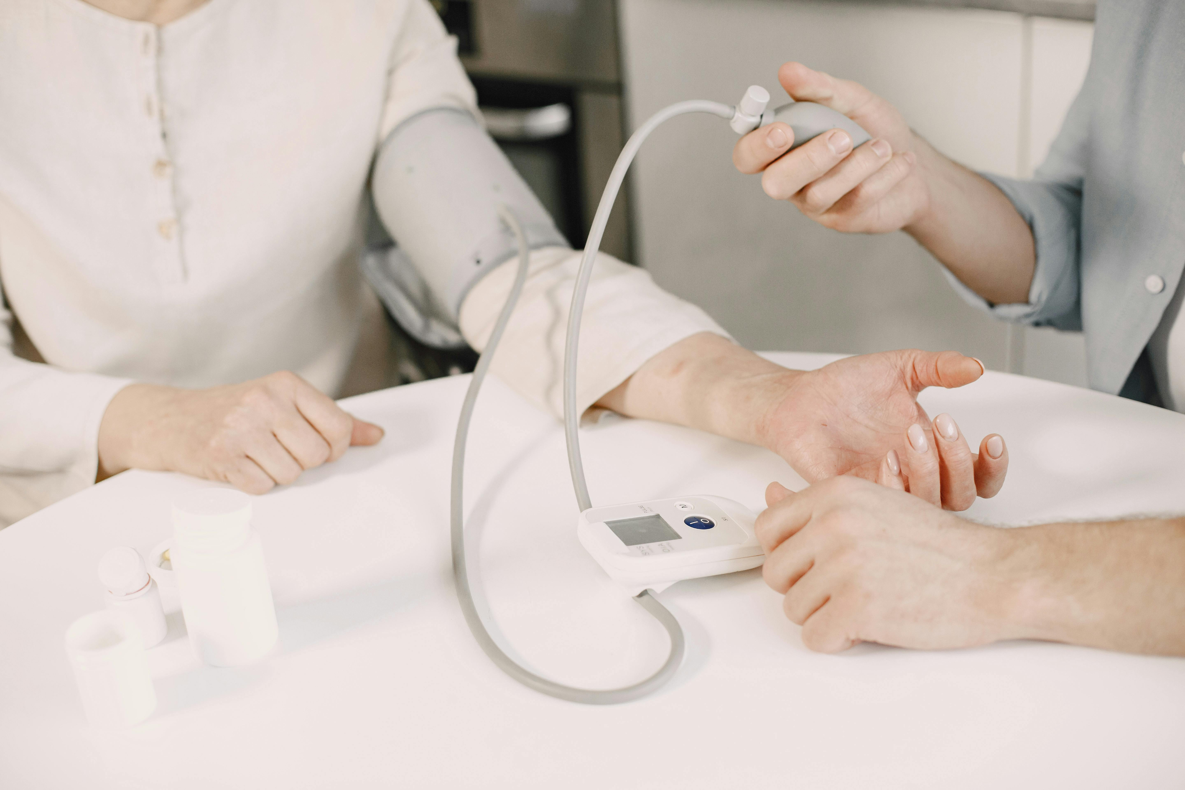Consultant physician with a client in a neutral consulting room