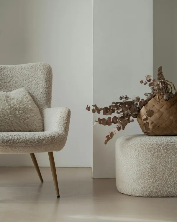 White chair next to plant