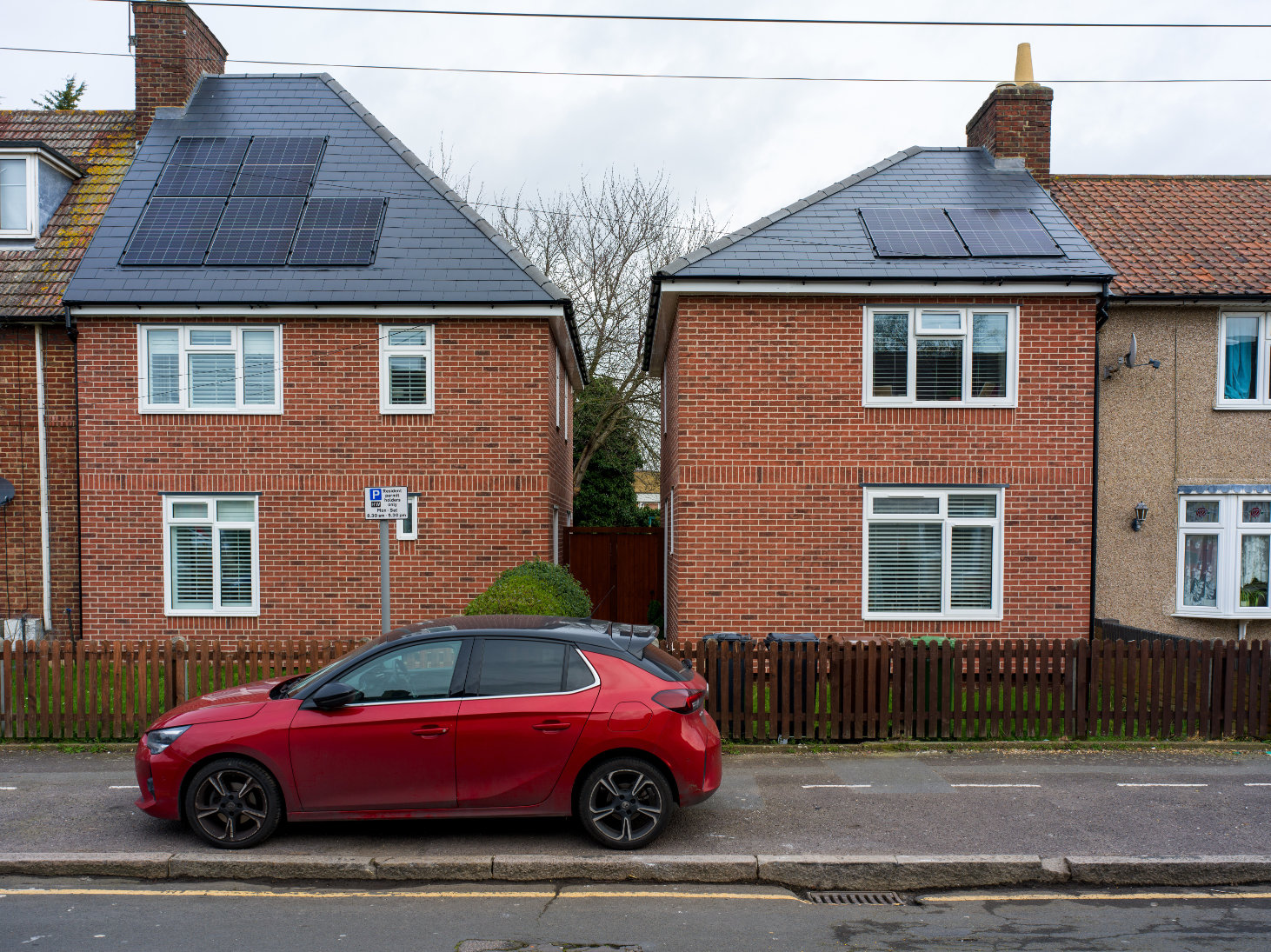 Two houses with new solar roof installations.