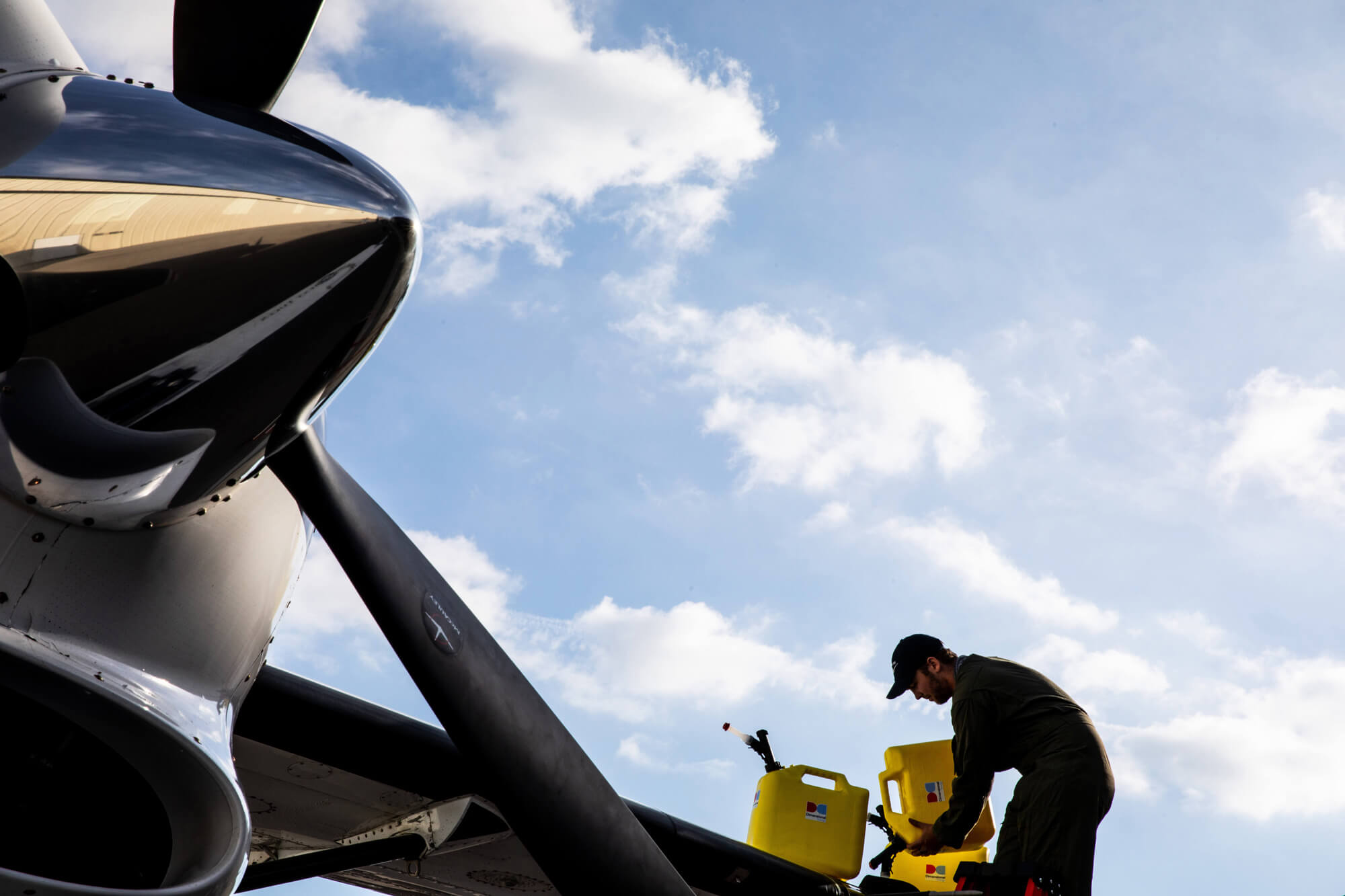 Aircraft being refueled with sustainable aviation fuel