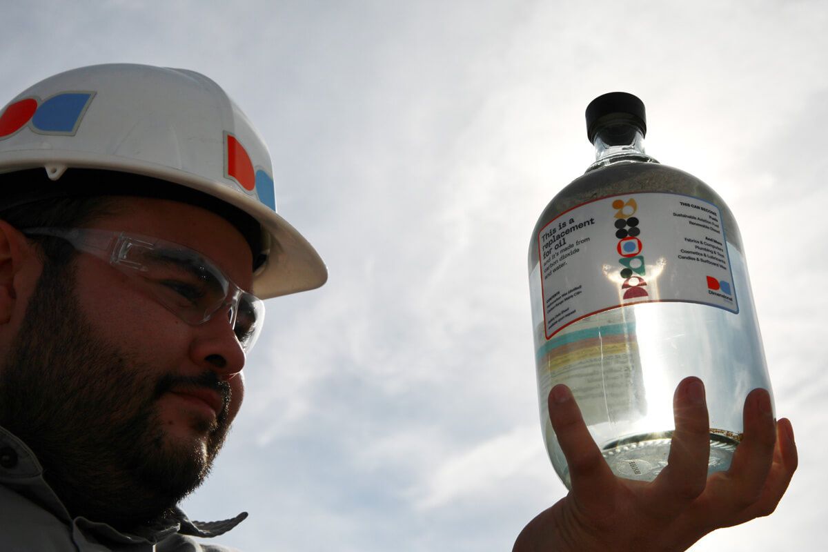 A man looks at a jug of eSAF.