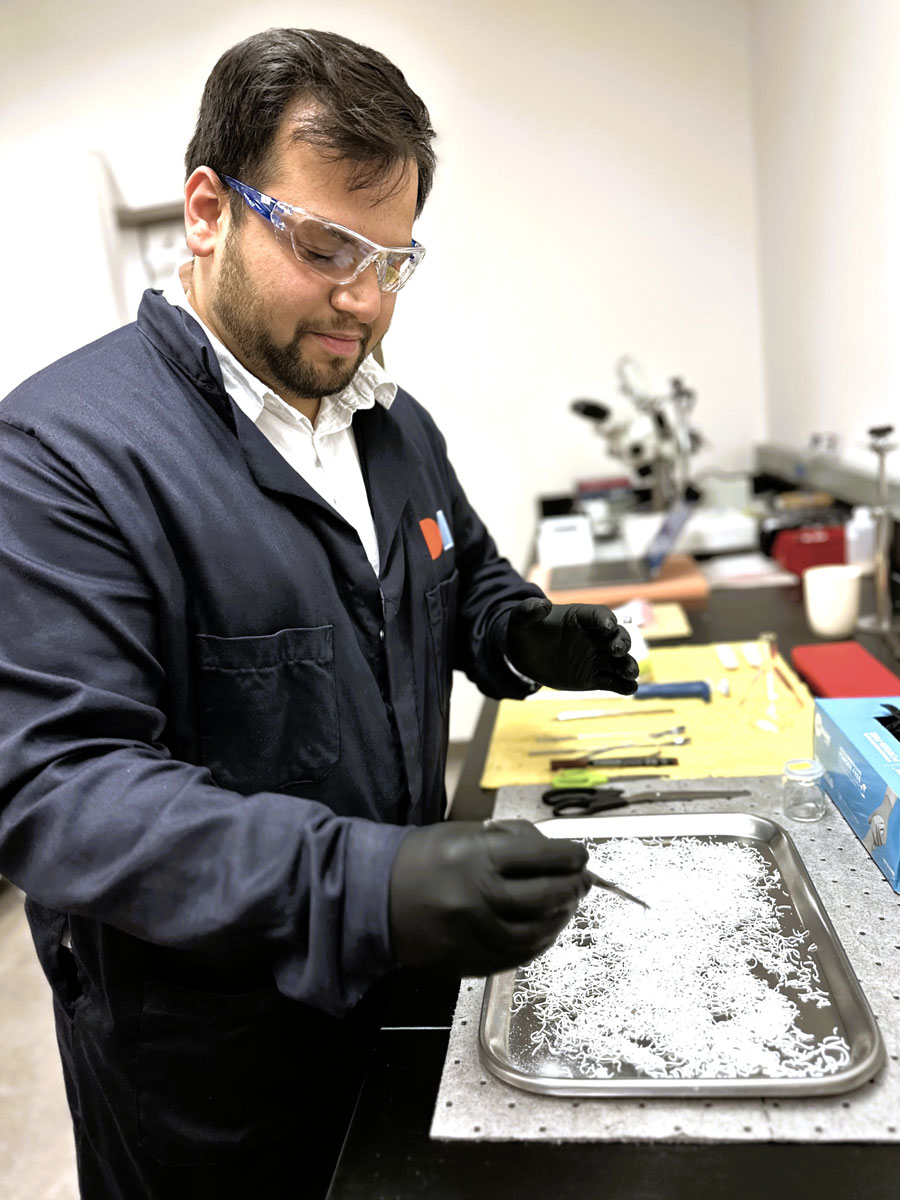 A Dimensional Energy employee works with our catalyst.