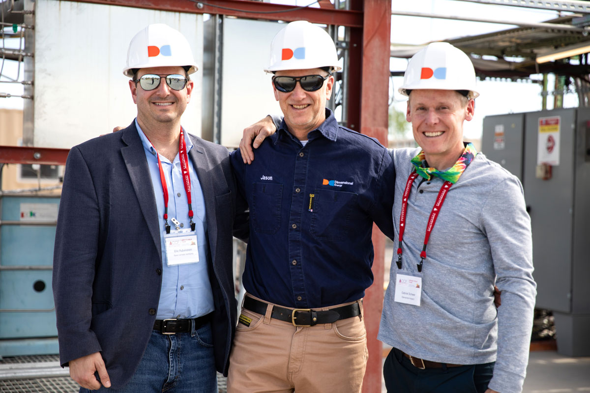 Dimensional Energy employees working at a computer.