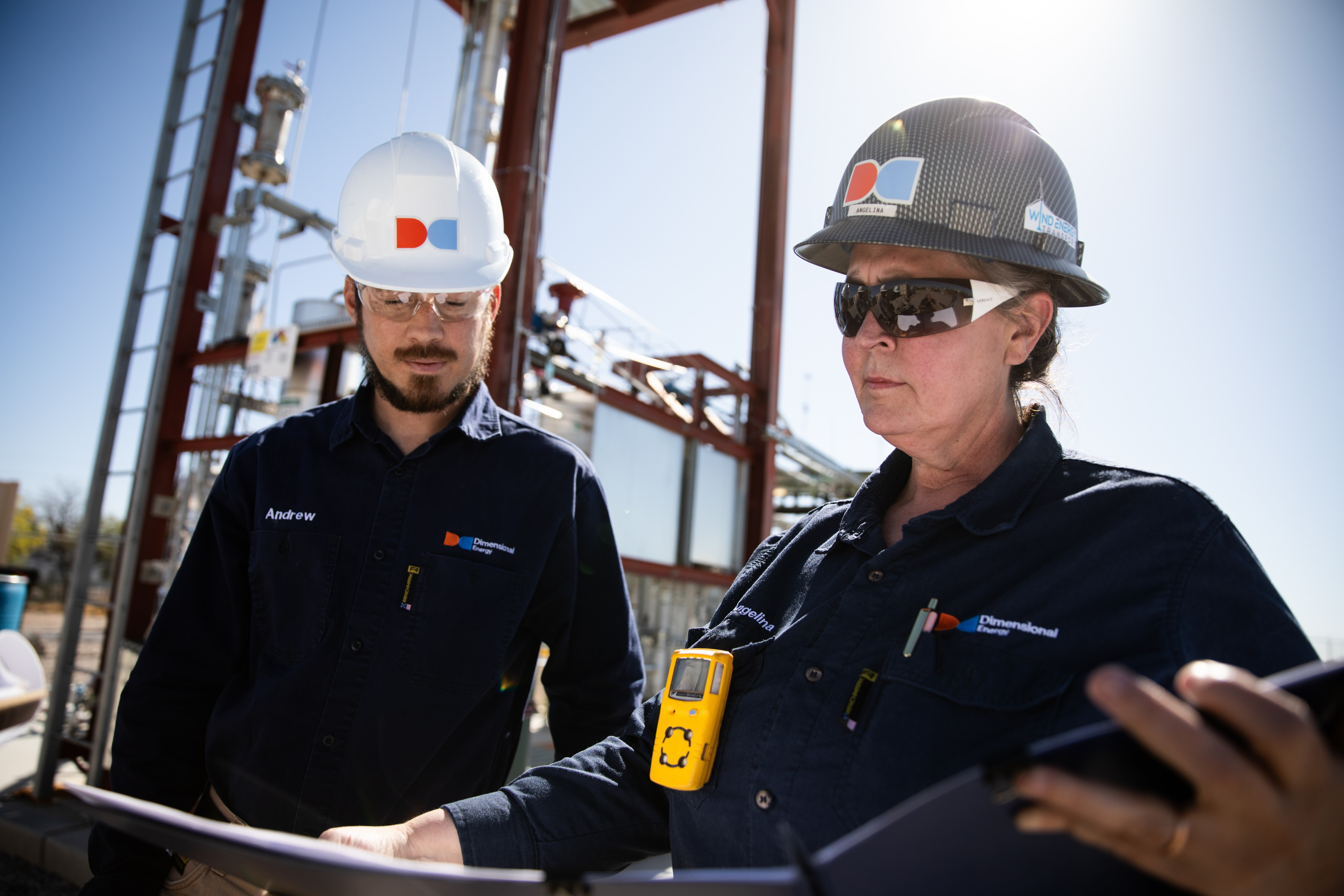 Andrew Maged and Angelina Farrar review notes at our Tucson Technology Center.