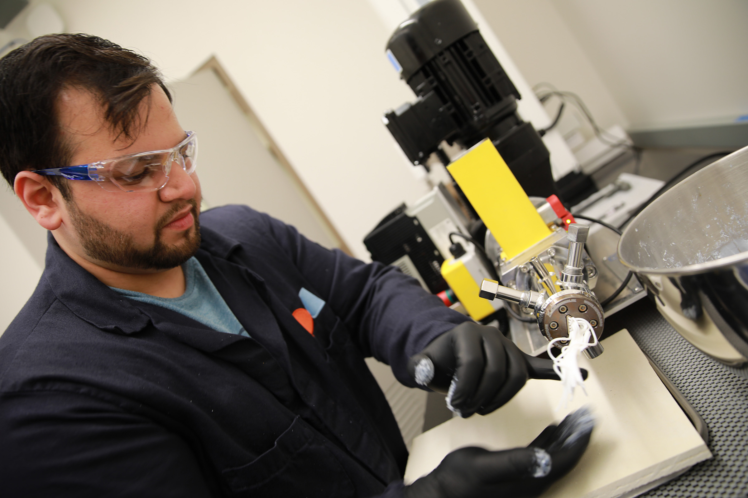 Catalyst Engineer Tej Chavan working with the extruder in our R&D Lab in Ithaca, NY.
