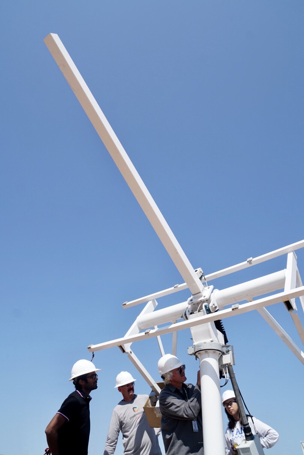 We were all smiles as the tracker reared its head for the first time, Mihir holding the reins with software he helped develop. With his notes, Brian gives the beast some love.