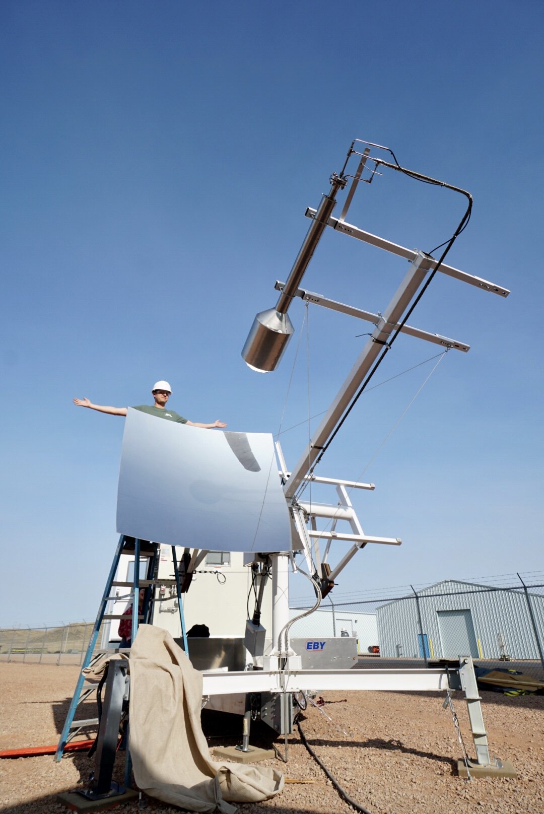 With focal point set, Brad removes the mirror’s cover and sends the full force of the sun into the reactor.