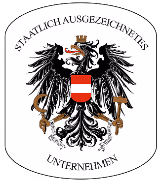Österreichisches Staatswappen mit schwarzem Adler und rotem-weißem Schild, umgeben von Schriftzug 'Staatlich ausgezeichnetes Unternehmen'.