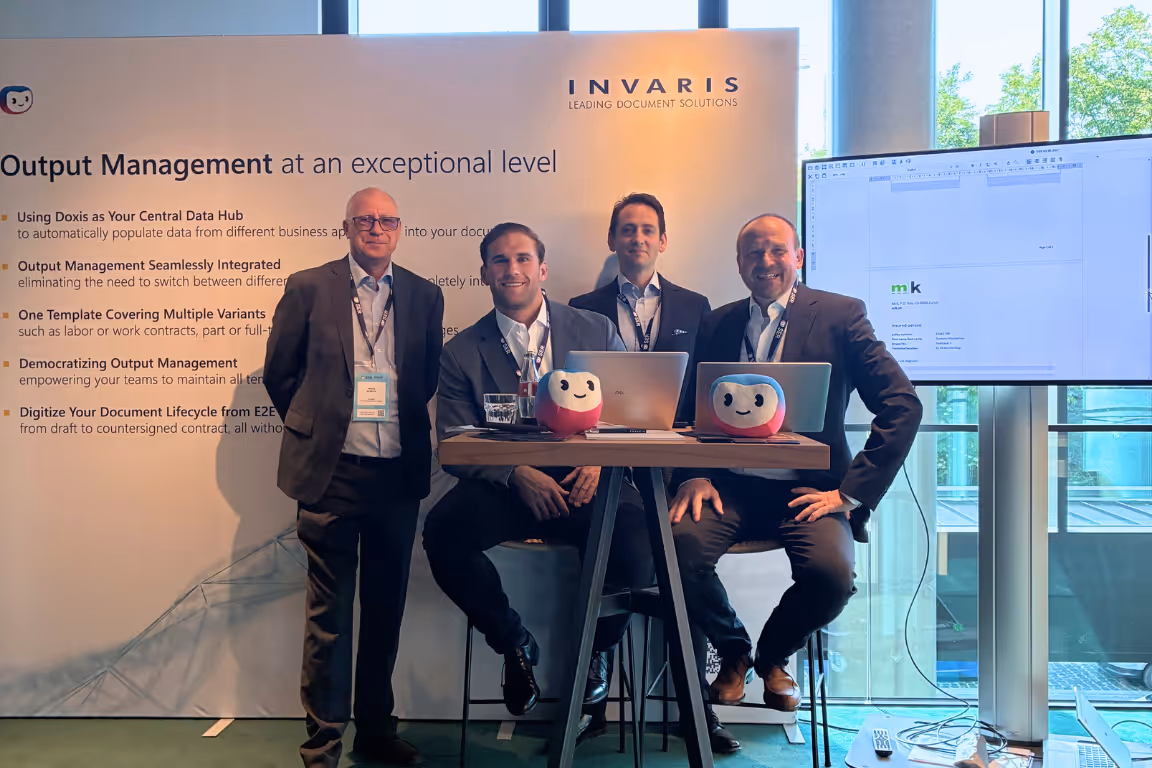 Franz Guszich, Markus Kruisz, Raphael Stracke, Dieter Schmidt vor einer Messewand
