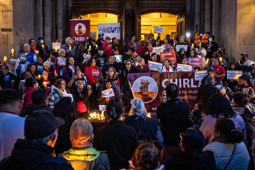 Los Angeles, CA - January 21: Community members gather at a vigil against deportations at Immanuel Presbyterian Church and then march to UTLA in Koreatown a day after Trump is sworn on Tuesday, Jan. 21, 2025 in Los Angeles, CA. (Jason Armond / Los Angeles Times)