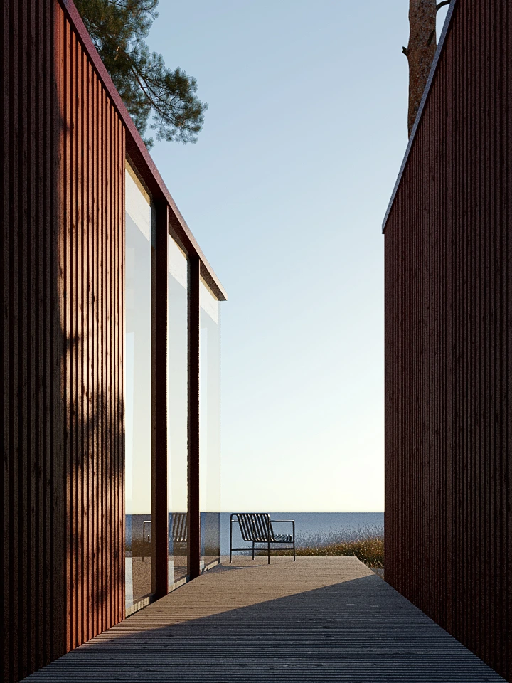 Modern wooden house with large glass windows facing a patio with a metal chair overlooking a calm sea under a clear sky.