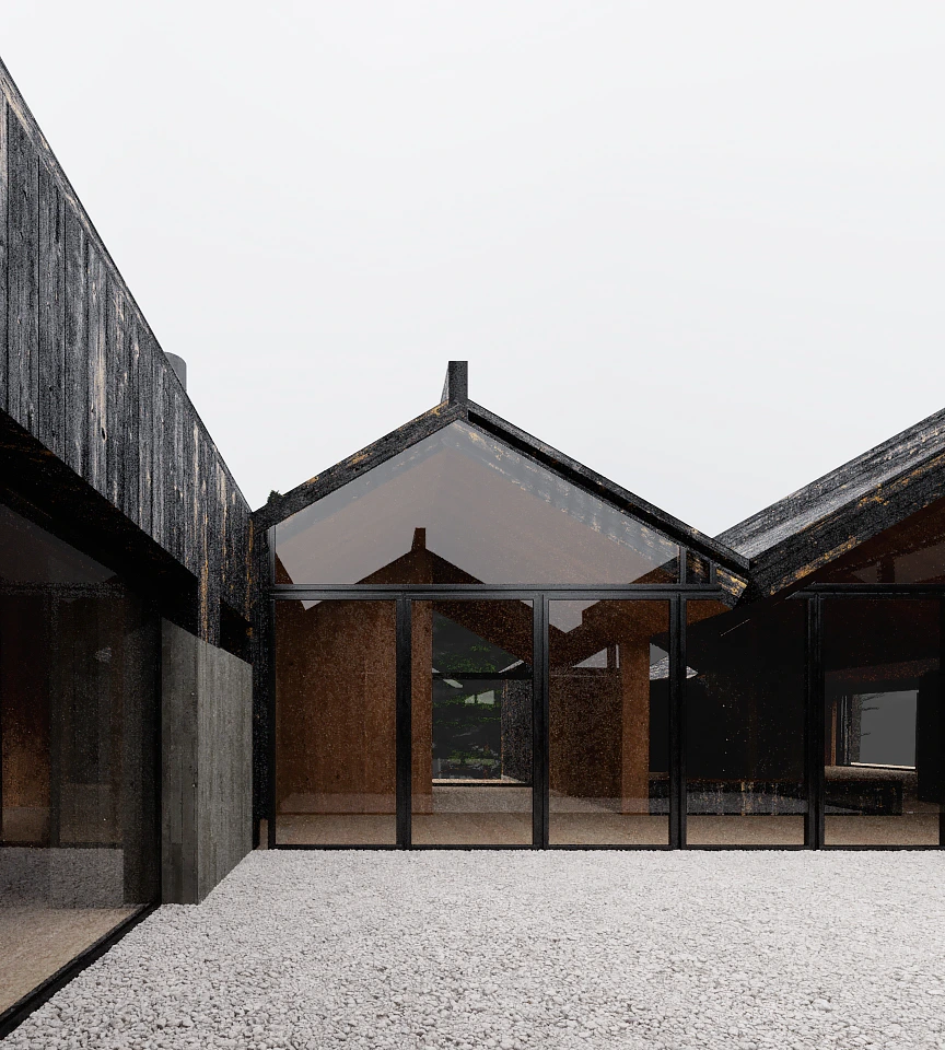 Modern building exterior with large floor-to-ceiling glass windows and dark wooden cladding surrounding a gravel courtyard.