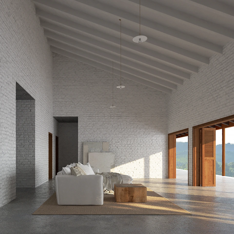 Spacious living room with white brick walls, vaulted ceiling, white sofa, wooden coffee table, and large open wooden doors showing greenery outside.