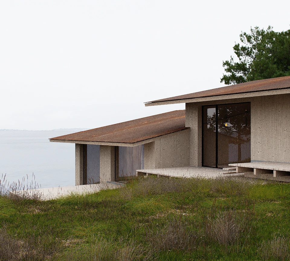 Modern house with slanted brown roofs and large glass doors overlooking a calm body of water and grassy foreground.