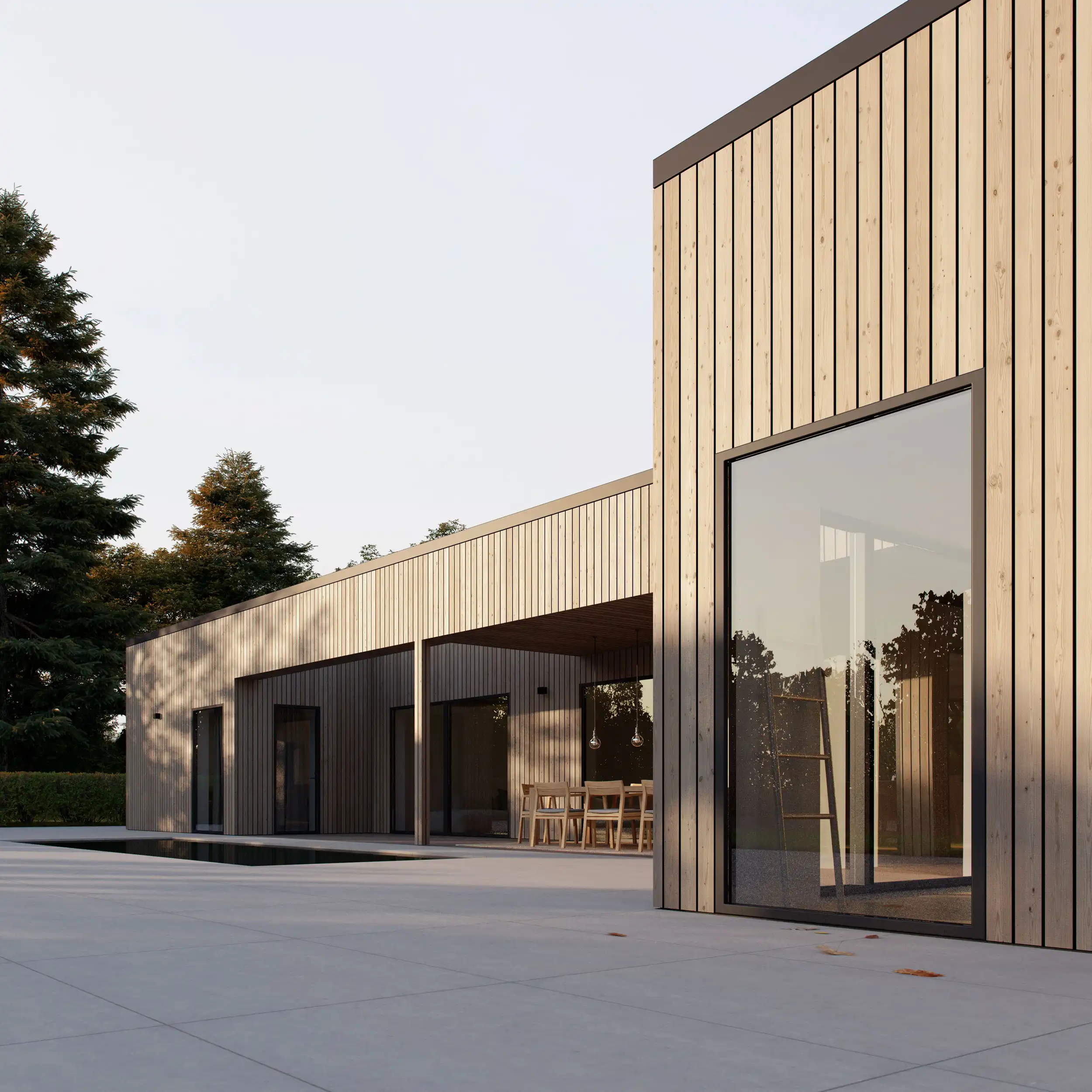 Modern single-story house with vertical wooden paneling, large windows, and outdoor patio area set against a clear sky.