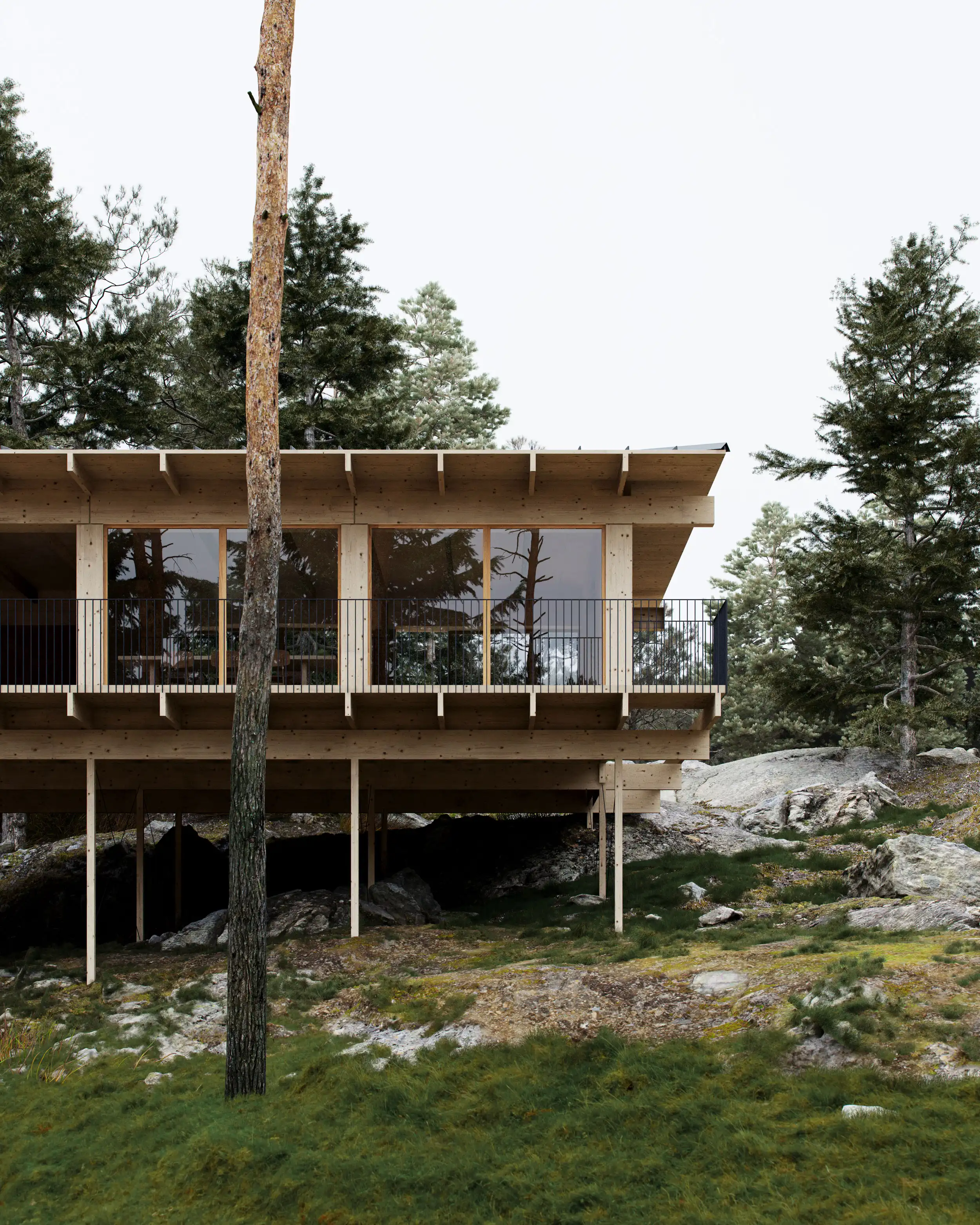Modern wooden house elevated on stilts surrounded by rocks, grass, and pine trees.