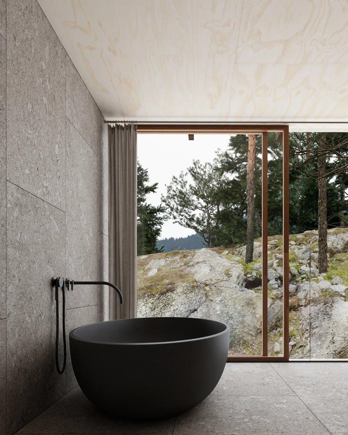 Modern bathroom with a black freestanding tub, gray tiled walls and floor, and a large window showing rocky terrain and pine trees outside.