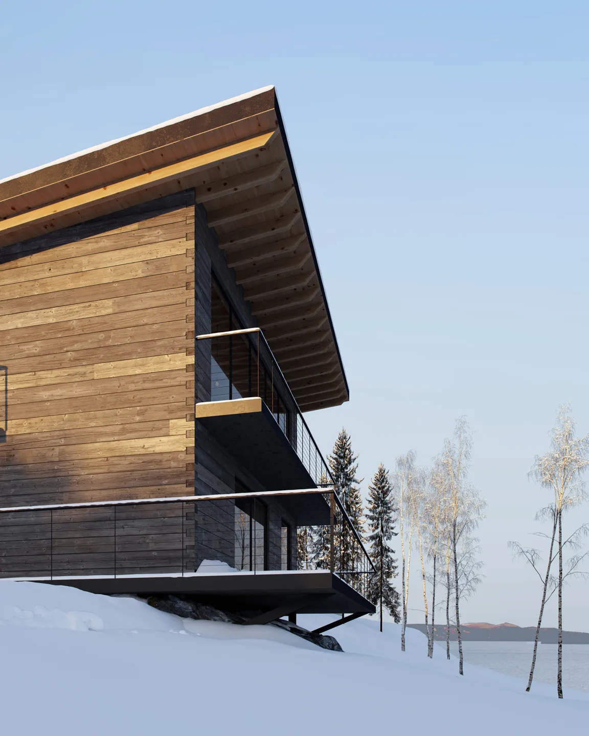 Modern wooden cabin with large wraparound balcony overlooking snowy landscape with birch trees and distant hills by a lake.