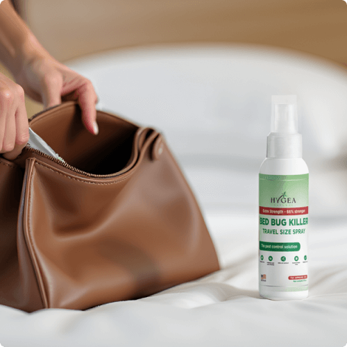 Brown handbag opened with spray bottle on bed