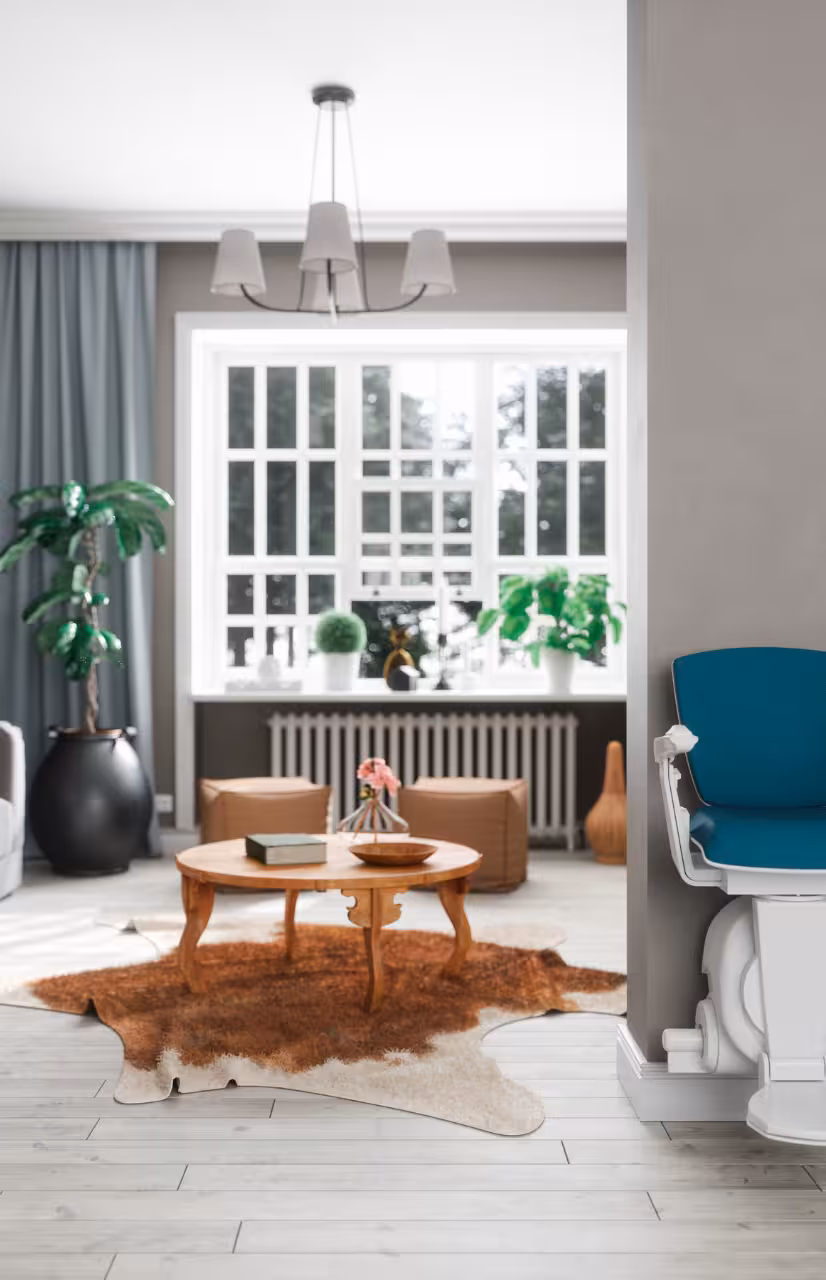 Modern living room with a stairlift installed at the edge of the staircase, designed to improve home accessibility.