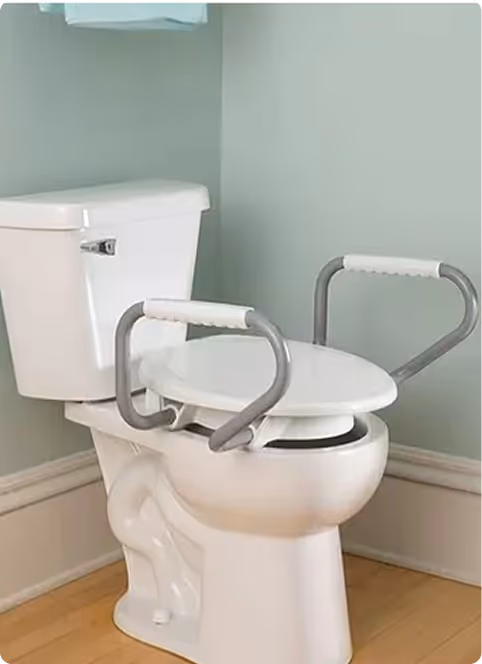 Raised toilet seat with side grab bars for safe and independent bathroom use.