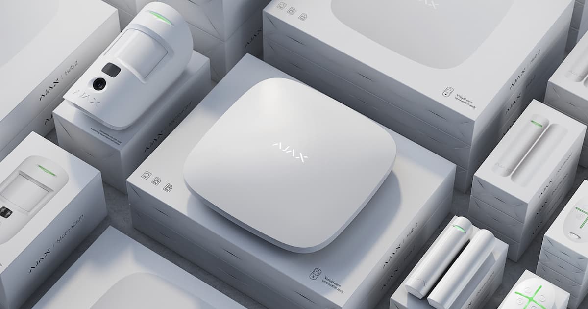 Ajax Systems wireless security equipment including hub, motion sensors, door sensors, and smart devices for home and business security