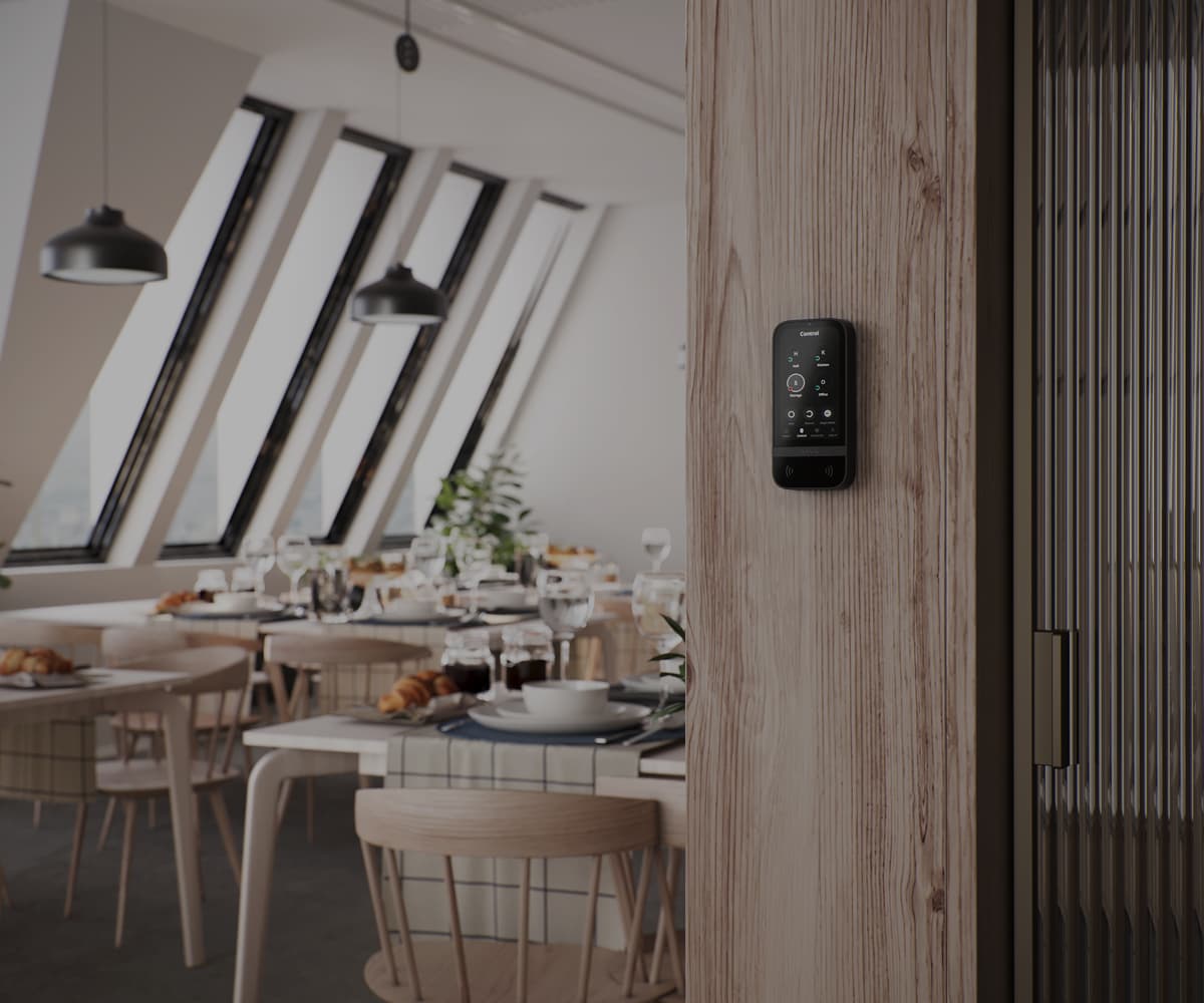 Commercial Ajax Systems security keypad installed in a restaurant for professional business security and access control