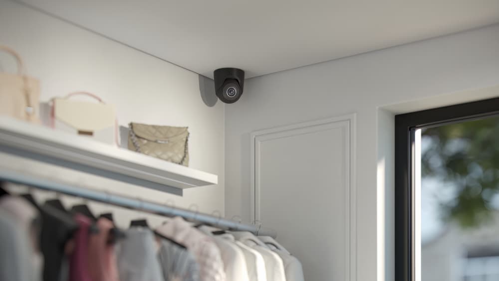 Ajax Systems motion detector and camera installed in a retail store to protect merchandise and monitor entry points