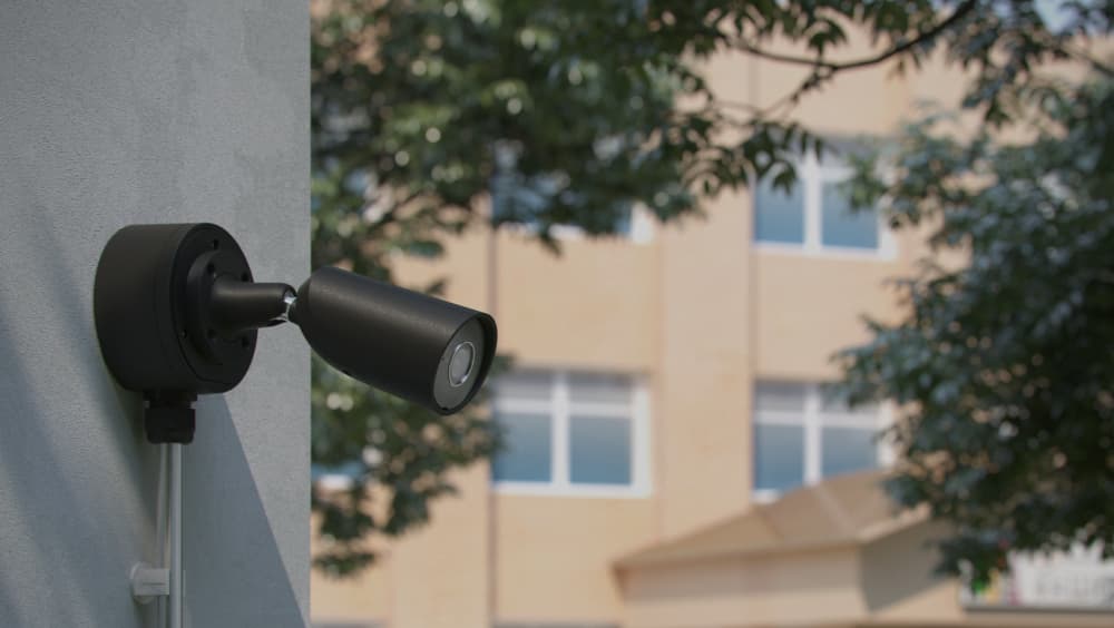 Ajax Systems outdoor security camera installed at an educational facility for campus monitoring and after-hours protection