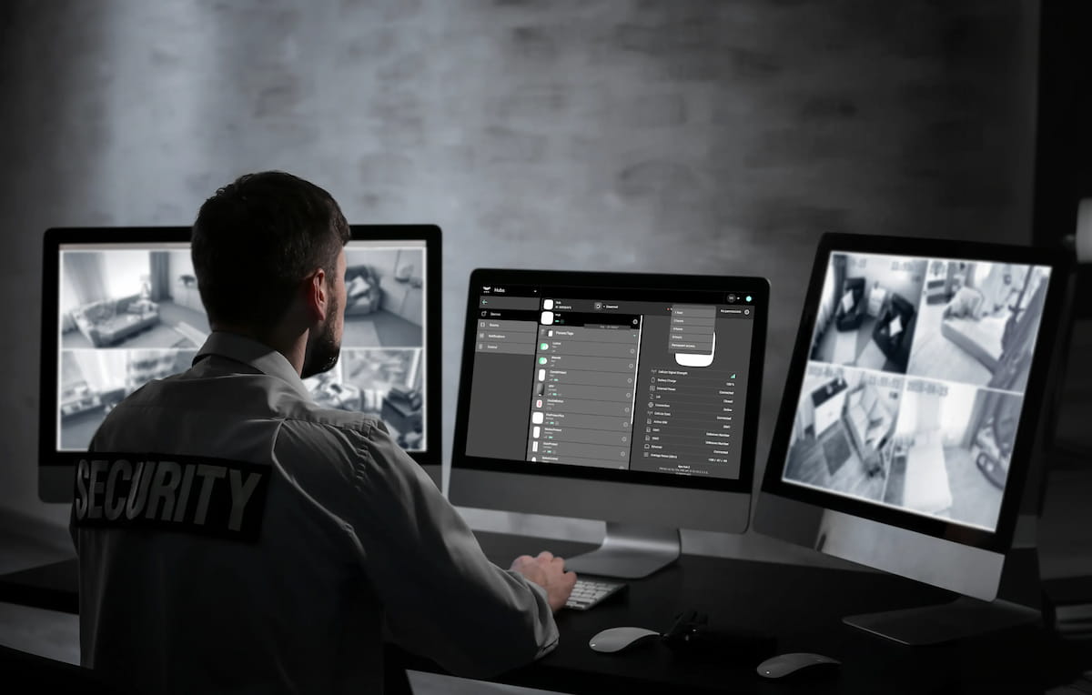 Professional security monitoring operator dispatching police and fire emergency services - 24/7 UL-certified alarm response