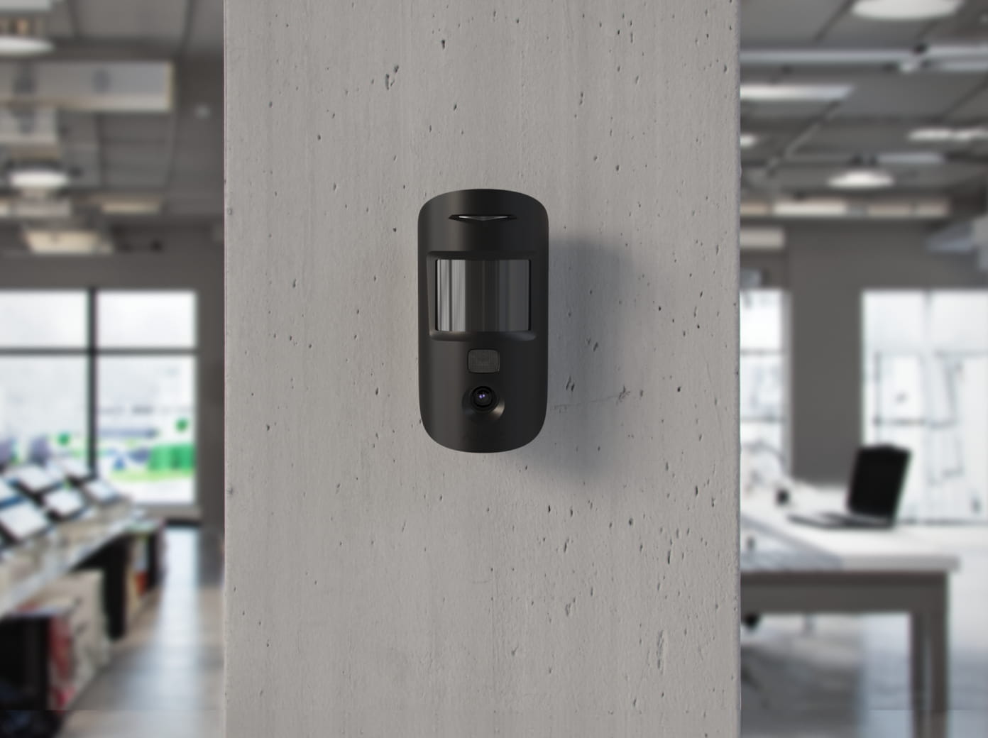 Ajax MotionCam motion detector with photo verification on a retail sales floor — after-hours intrusion detection for Houston stores