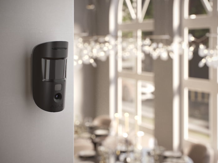 Ajax MotionCam with photo verification in a restaurant dining room — after-hours motion detection for Houston restaurants