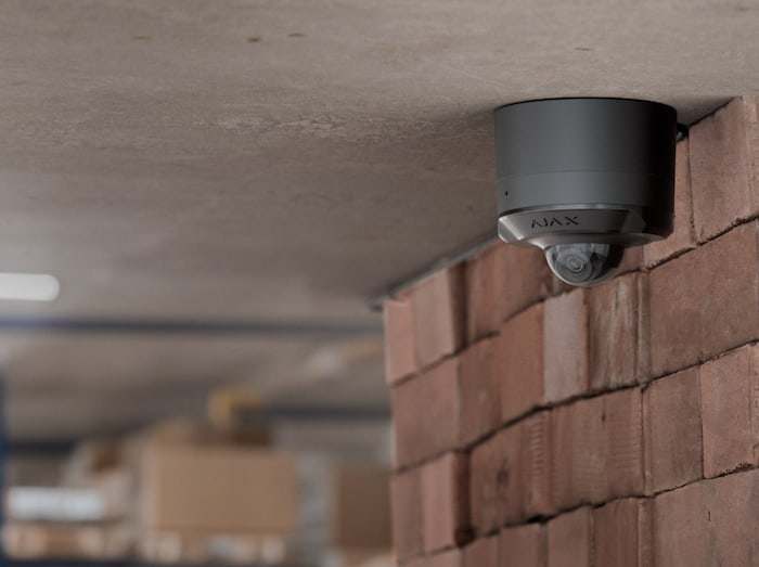 Ajax security camera monitoring a restricted inventory area inside a warehouse